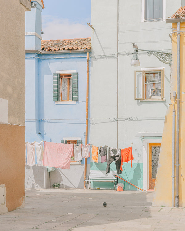 An image of some houses, with washing hanging outside, by emerging Portuguese photographer Teresa Freitas.